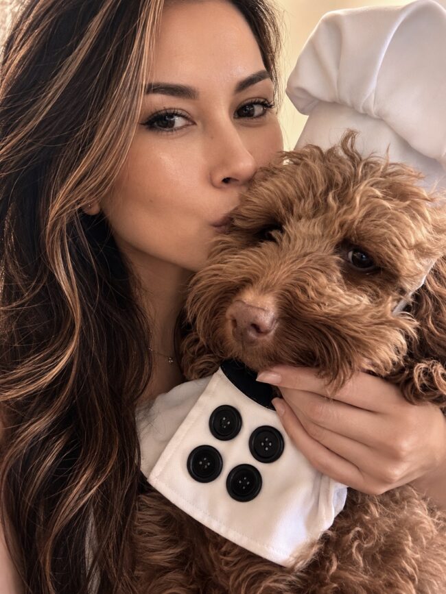 Juliette Fechter and goldendoodle Romeo in a chef costume